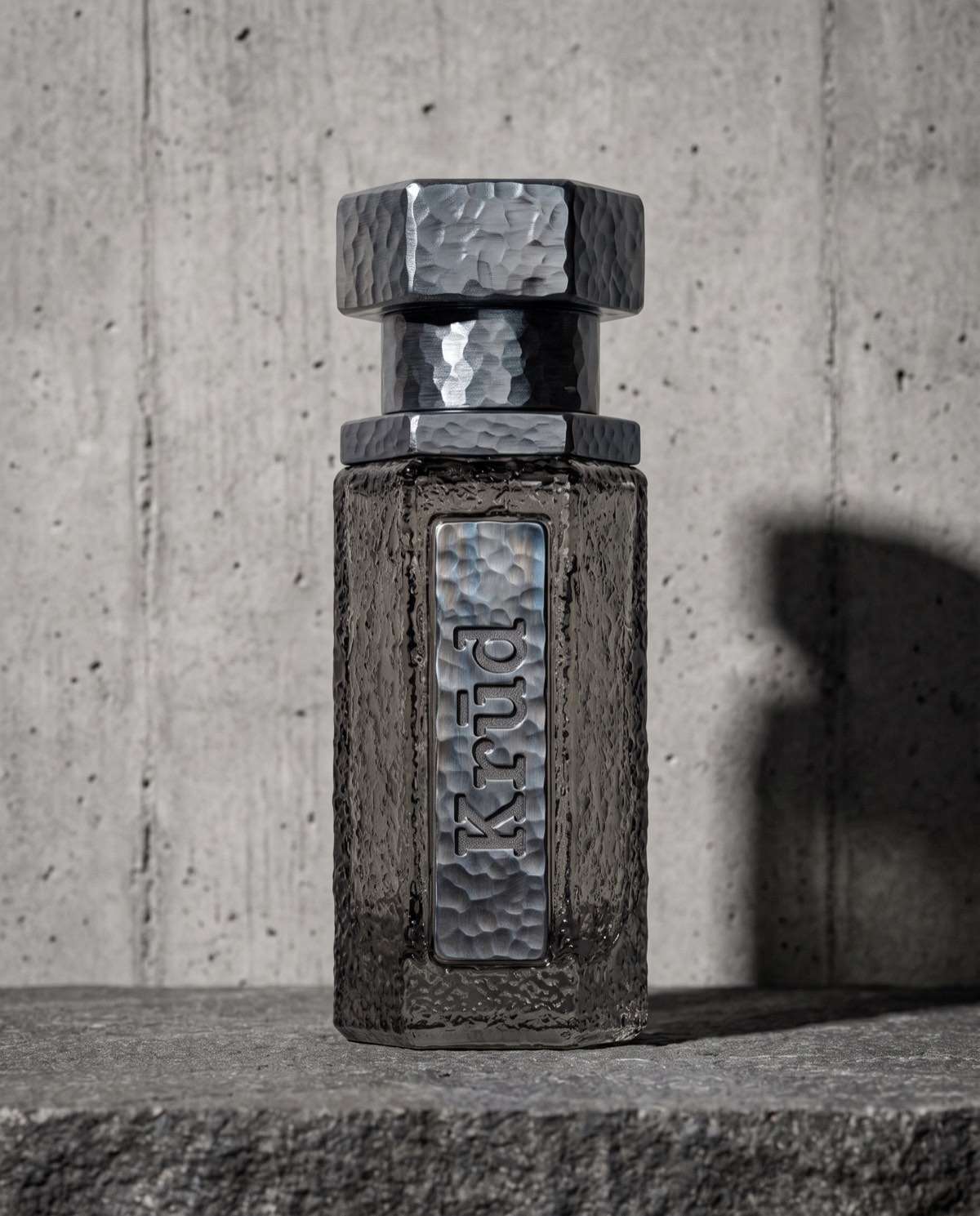 Basalt — slate grey hammered glass bottle with burnt steel hex cap